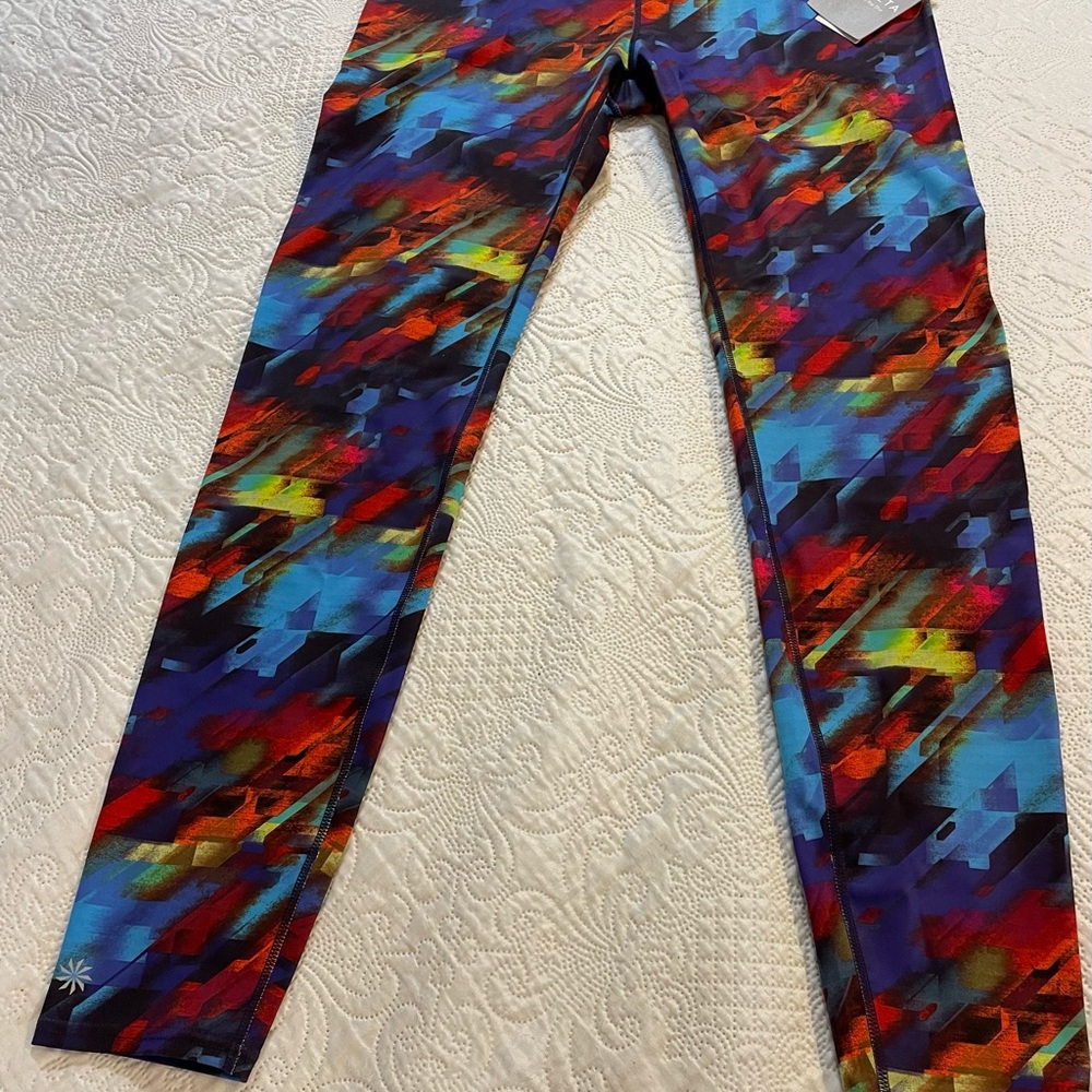 NWT Athleta Colorburst Sonar Tight XLT. Zip bum pocket w/ reflective fabric.